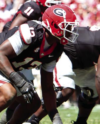 Georgia edge rusher Mykel Williams (13) lines up before a play during the annual G-Day scrimmage. LANCE McCURLEY/Staff
